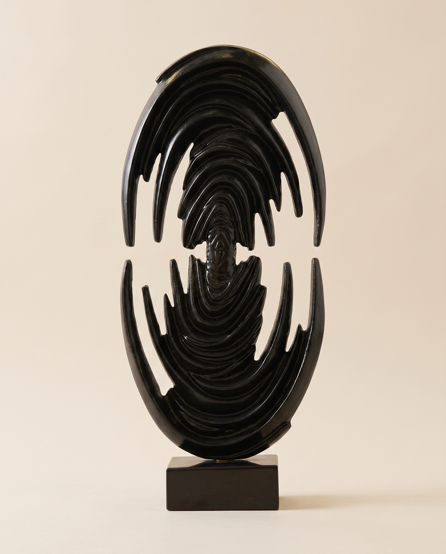 Glossy Black Brass Art Sculpture Venus Form - warm ivory studio hero shot