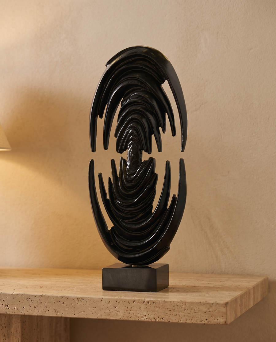 Glossy Black Brass Art Sculpture Venus Form - styled warm beige console scene