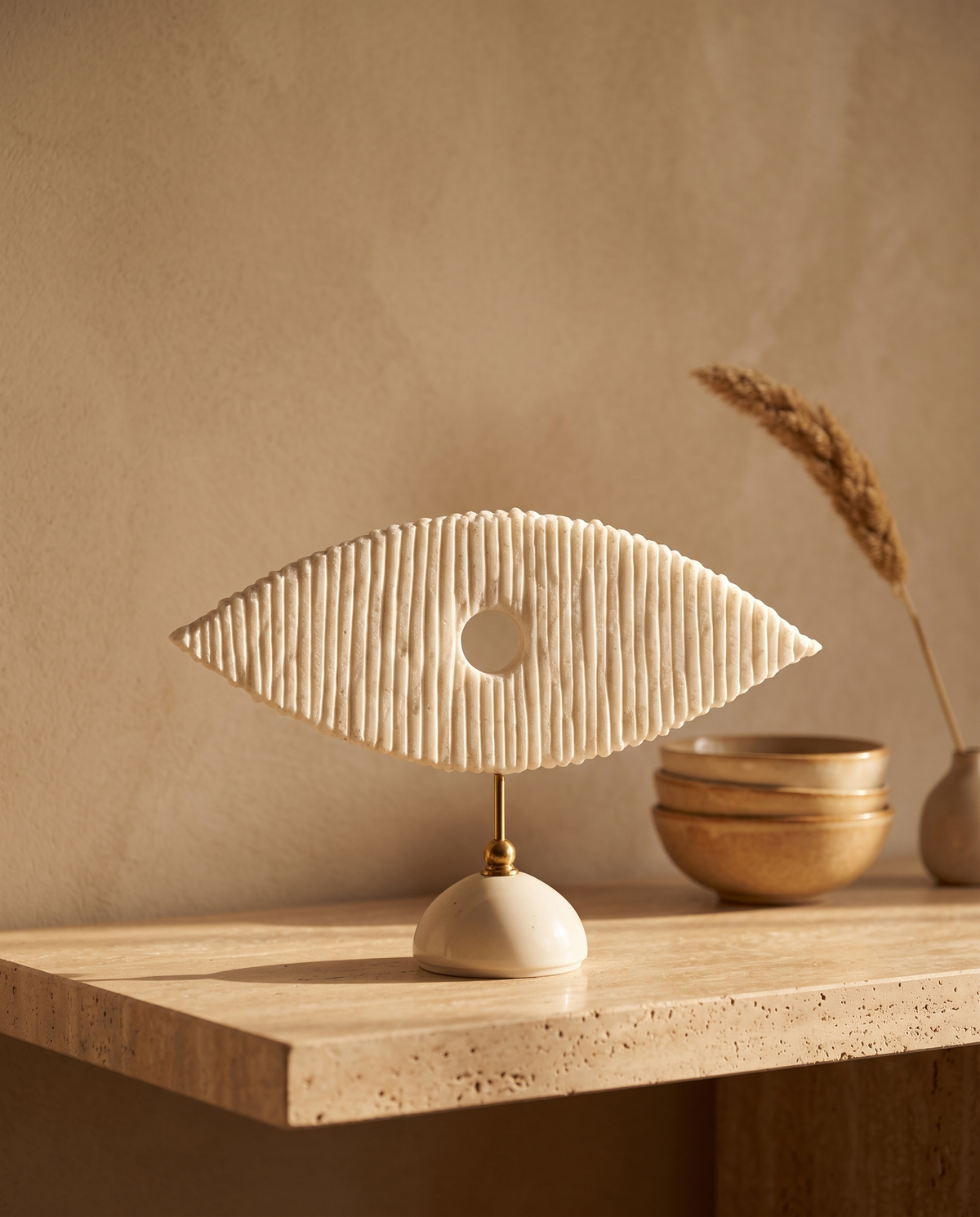 White Marble Eye Sculpture With Brass Stand - styled warm beige console scene