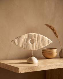White Marble Eye Sculpture With Brass Stand - styled warm beige console scene
