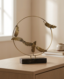 Pile Decor Sculpted Serenity in Brass - styled warm beige console scene