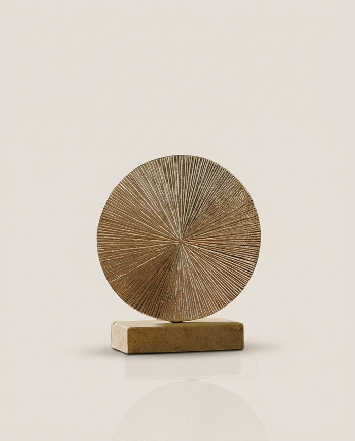 Golden Sun Disc – Sculptural Warmth on Travertine