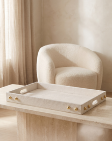Ivory Textured Rectangular Tray with Golden Stud Accents - styled on a travertine console in a light interior