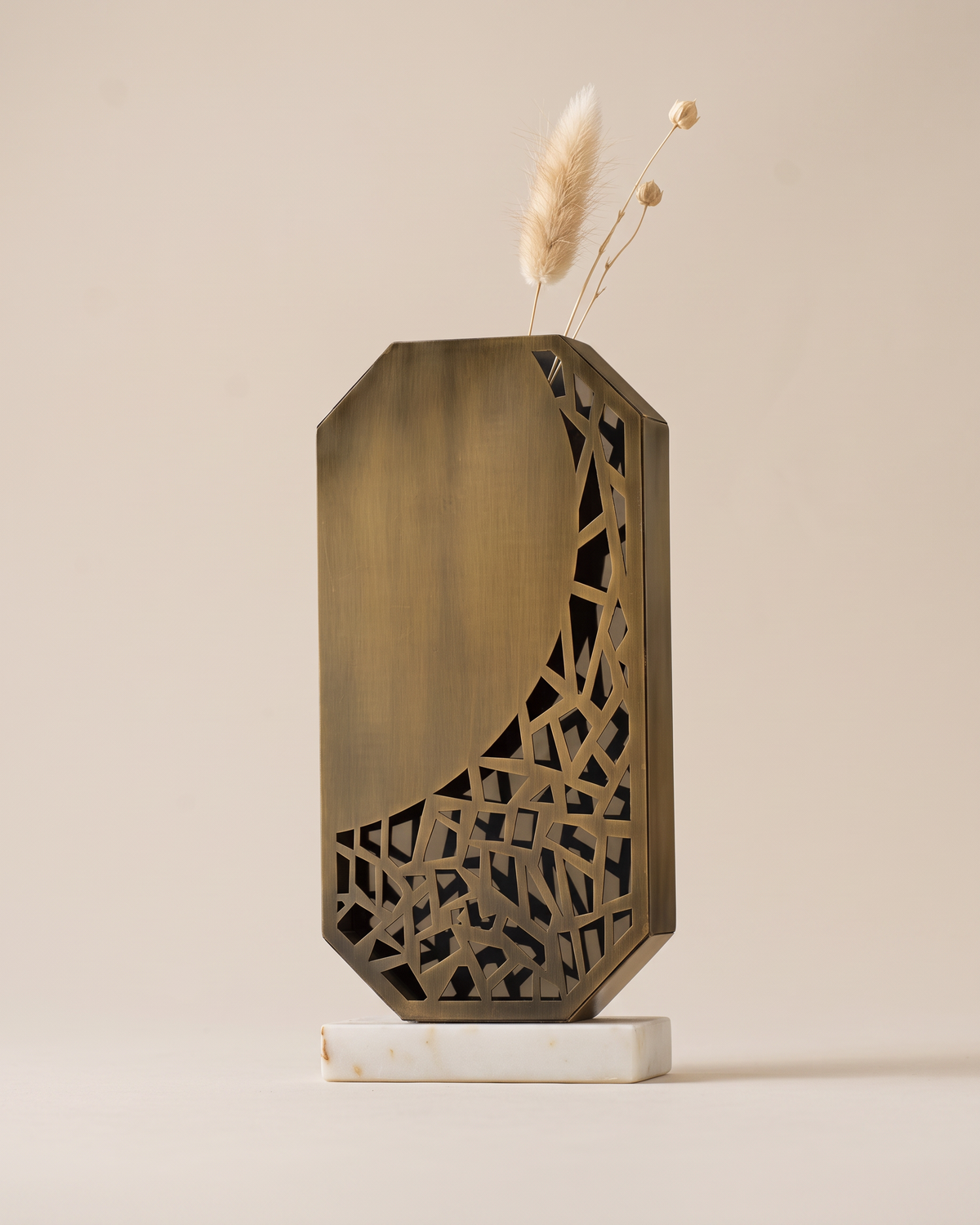 Laser-Cut Bronze Vase (One Piece) on a warm ivory studio background