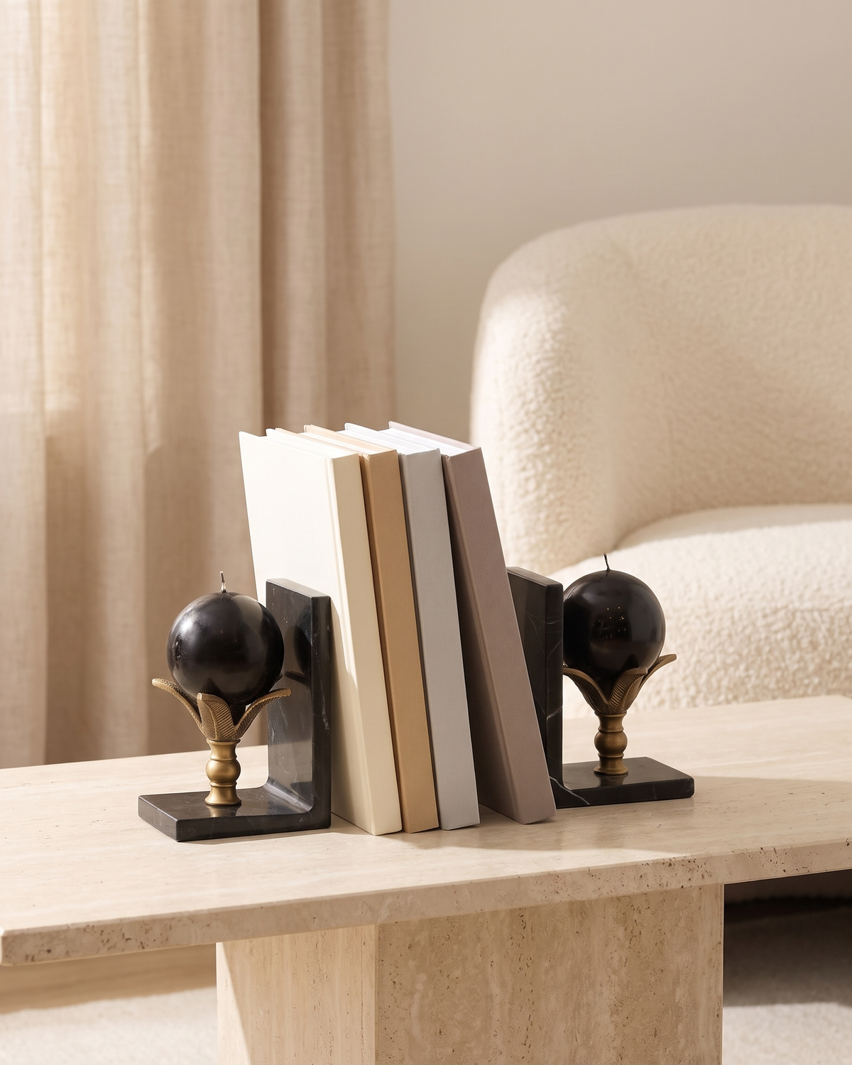 Lotus Sphere Marble Bookends - styled on a travertine console holding plain books
