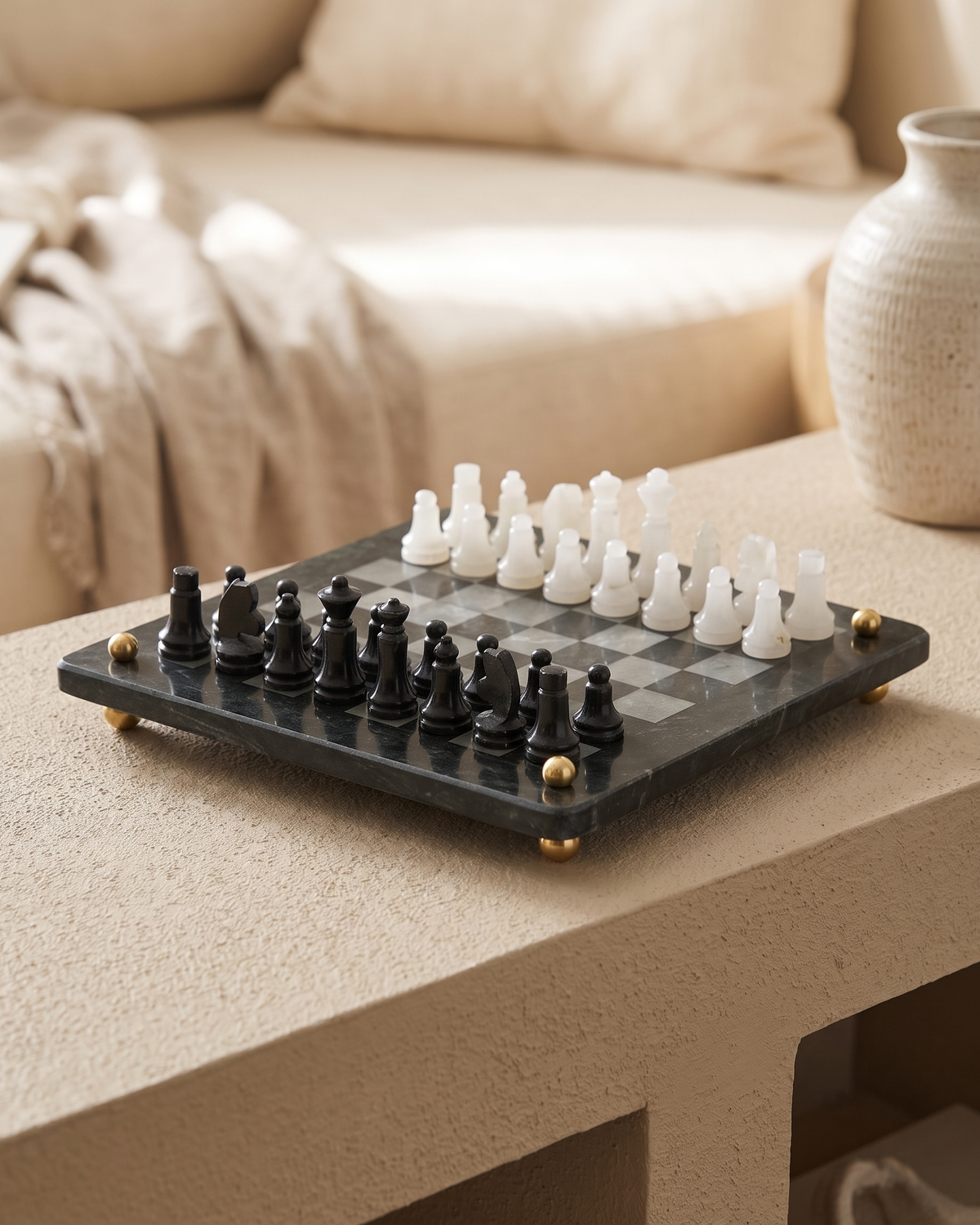 Marble Chess Set - styled on a warm beige console in a cosy interior