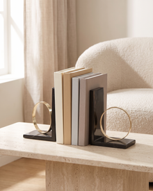 Modern Ring Bookends with Black Marble Base - styled on a travertine console holding plain books