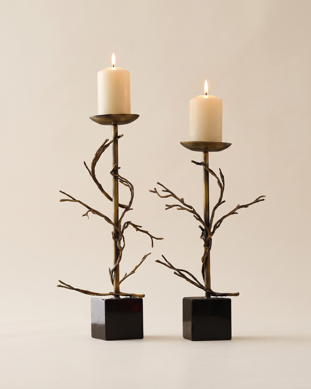Aged Brass Branch Candle Holder - with lit candles, ivory studio background