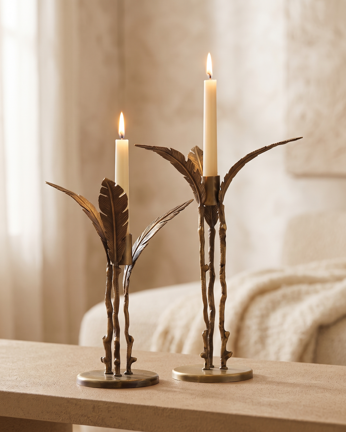 Pleated Candlestick Large - with lit candles, styled on a warm beige console in a cosy interior