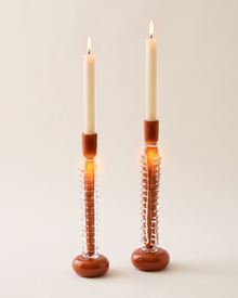 Ridged Glass Candle Holder Large - with lit candle, ivory studio background