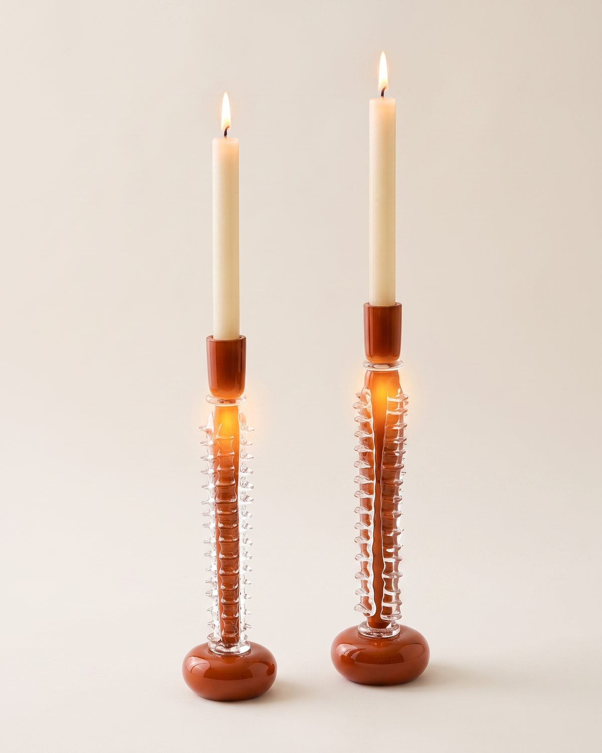 Ridged Glass Candle Holder Medium - with lit candle, ivory studio background