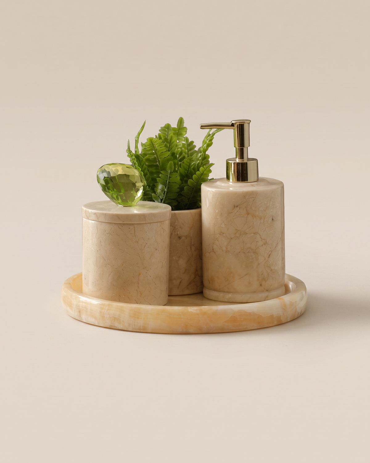 Round Beige Marble Bathroom Set with Crystal Knob (Set of 4) on a warm ivory studio background
