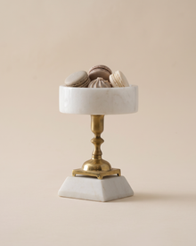 White Marble Serving Stand with Brass Pedestal (One Piece) on a warm ivory studio background