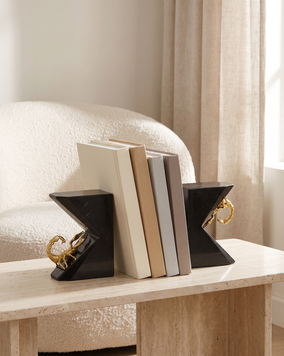 Scorpion Marble Bookends (Set of 2) - styled on a travertine console holding plain books