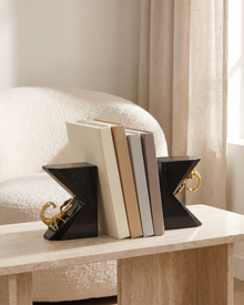 Scorpion Marble Bookends (Set of 2) - styled on a travertine console holding plain books