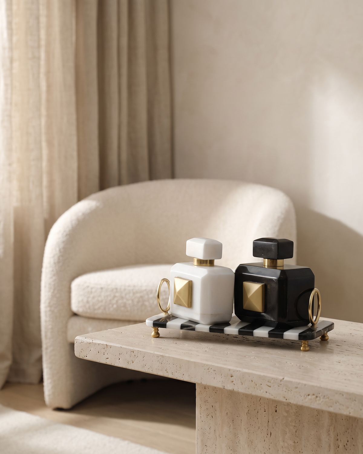 Set of 2 Decorative Marble Bottles on Striped Tray - styled on a travertine console in a light interior
