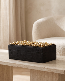 Textured Black Leather Box With Brass Bead Embellishment - styled on a travertine console in a light interior