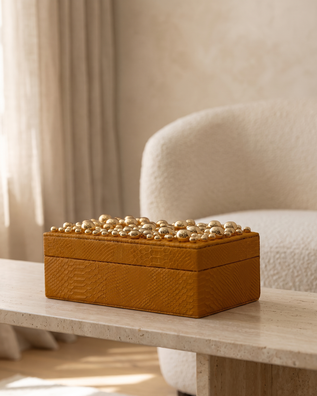 Textured Mustard Leather Box With Brass Bead Top - styled on a travertine console in a light interior