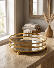 Three-Tier Round Mirrored Brass Tray, Gold (One Piece) styled in a warm interior