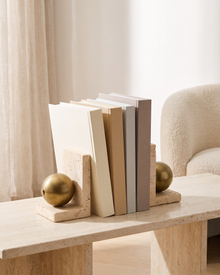 Travertine Book Stand with Brass Sphere - styled on a travertine console holding plain books