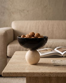 Travertine Bowl with Sphere styled in a warm interior setting