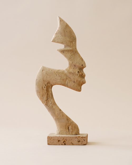 Abstract Face Travertine Sculpture (One Piece) on a warm ivory studio background