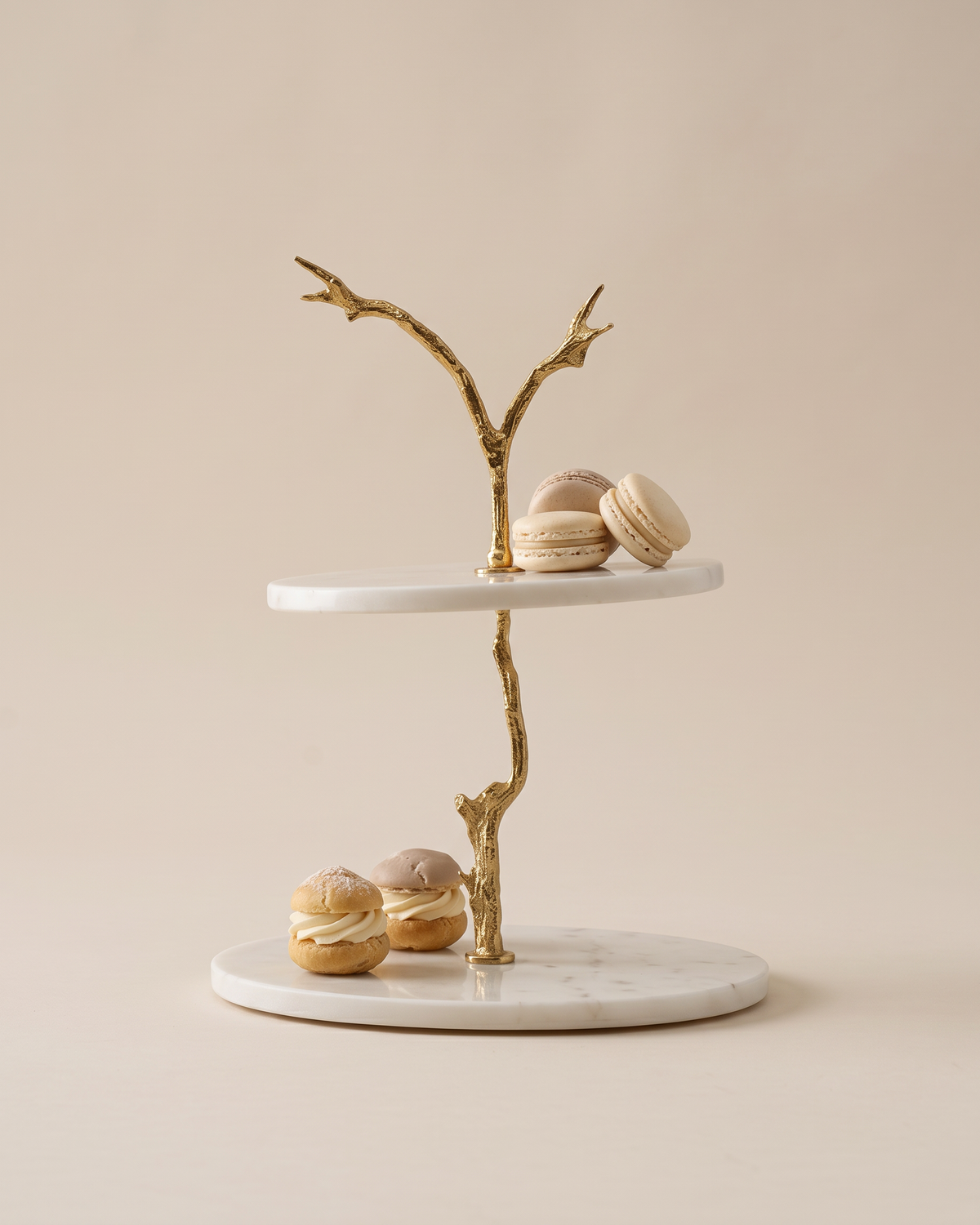 Two-Tier Marble Stand with Gold Branch (One Piece) on a warm ivory studio background