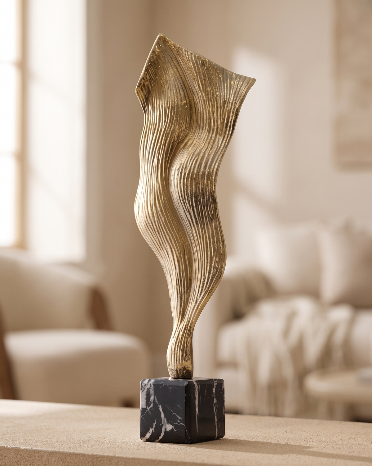 Wind Decorative Object Gold - styled on a warm beige console in a cosy interior